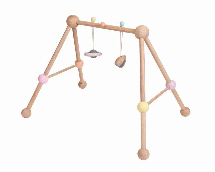 safe and non-toxic wooden toys for babies                   Plan Toys Play Gym Pastel