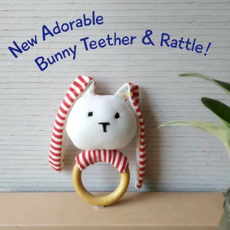 intricately carved wooden toys                   Striped Bunny Teether & Rattle Ring