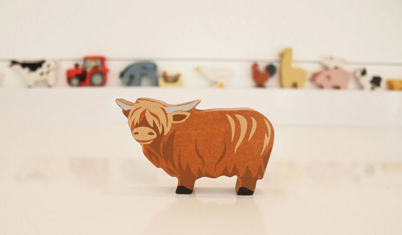enchanting wooden toys that spark imagination                   Wooden Highland Cow